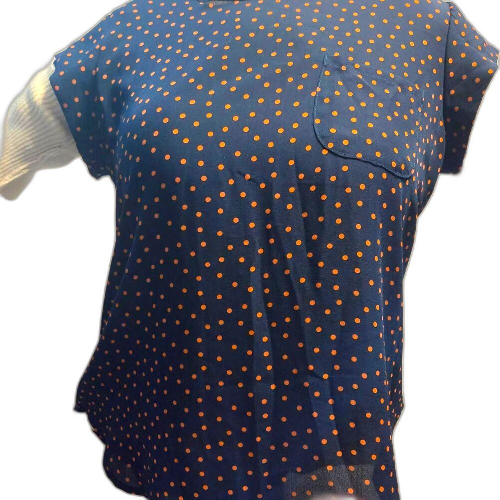 navy blue and orange polka dot top